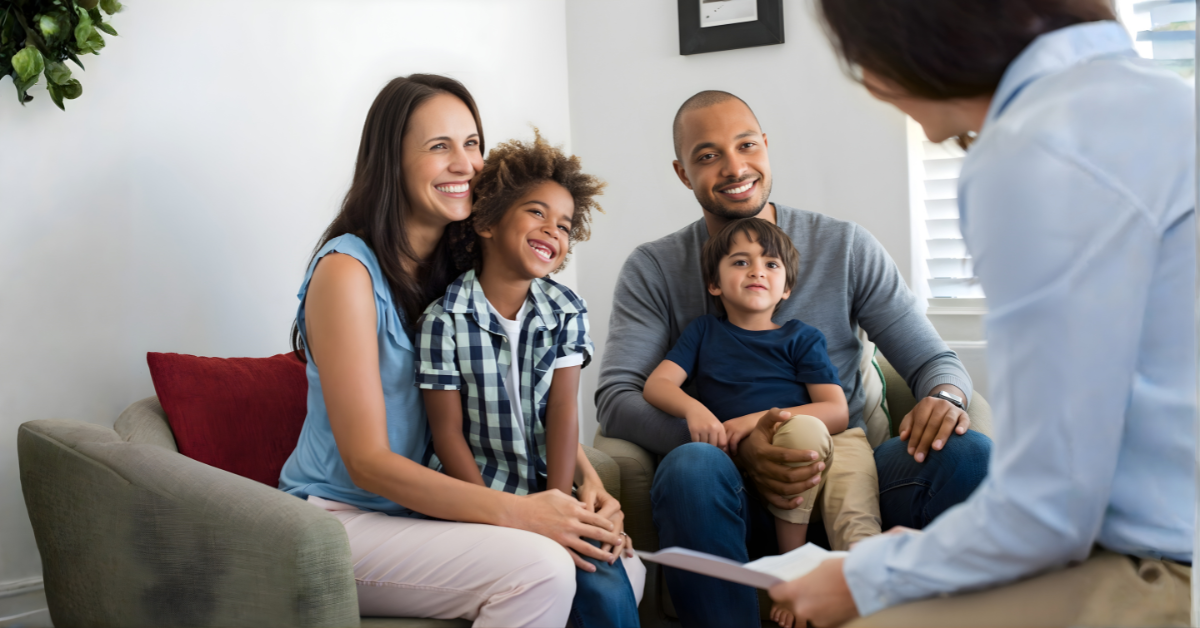 Parents and children meeting with a counselor to discuss parenting decisions during separation in a calm, supportive setting.
