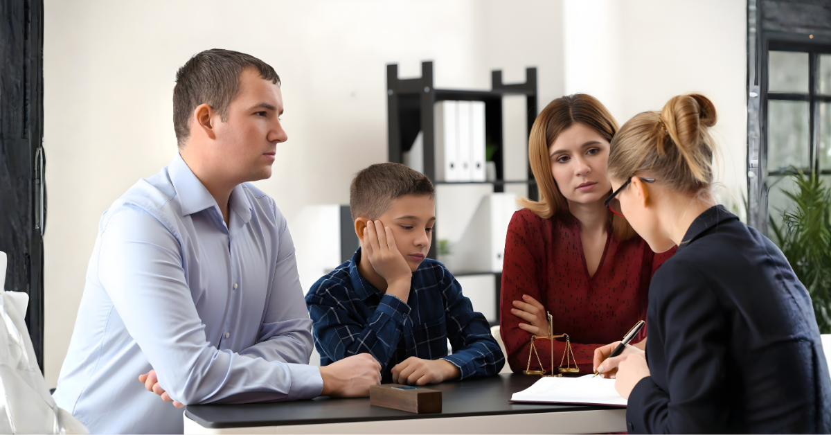 Parents meeting with a mediator to discuss temporary child custody orders for their child during separation.