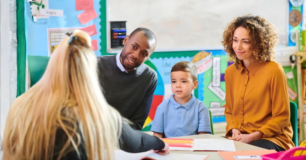 Co-parents revisiting their parenting plan together to adjust schedules for their child’s needs.